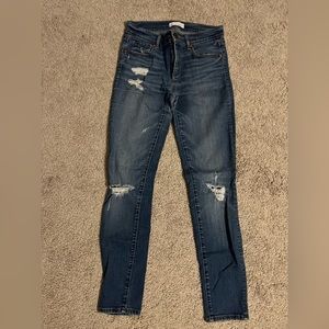 Distressed denim jeans